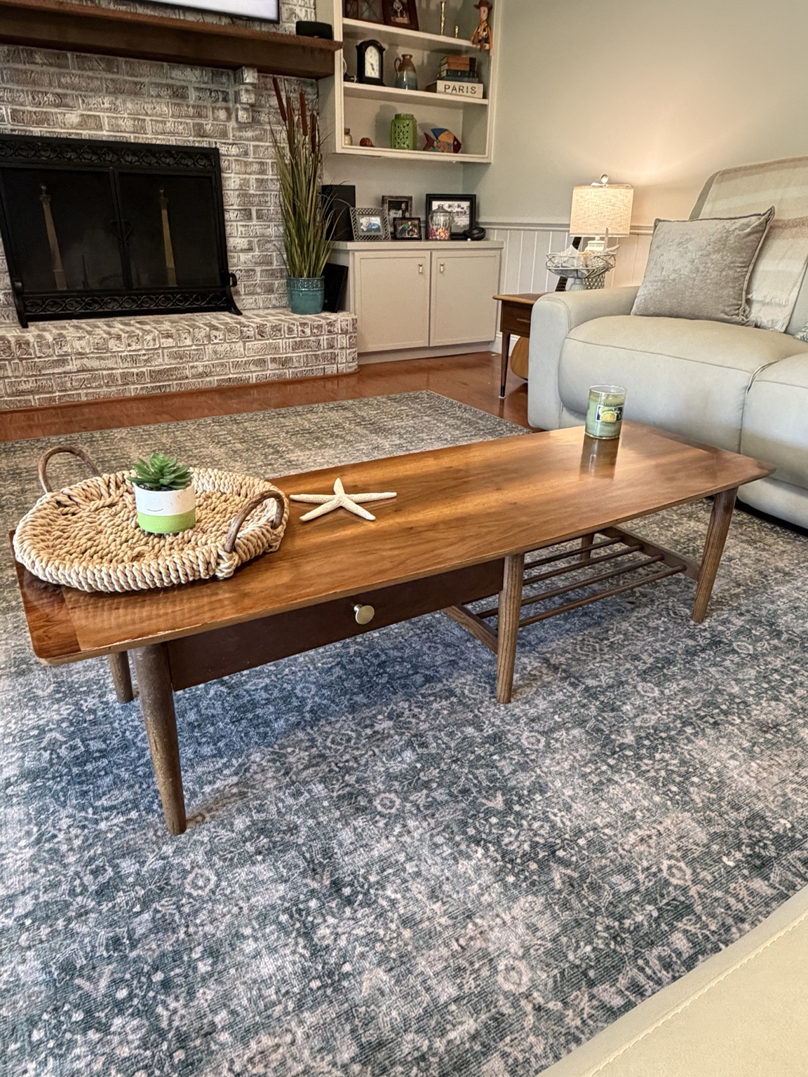 Restored mid-century modern coffee table staged in a living room
